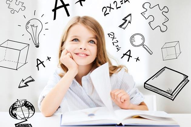 education and school concept – little student girl studying at school